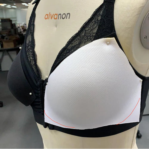 Black and white bra on a mannequin with 'alvanon' branding.